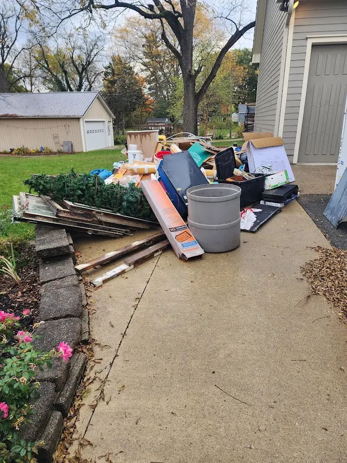 Dumpster being loaded with debris for Commercial Dumpster Rental in Atoka